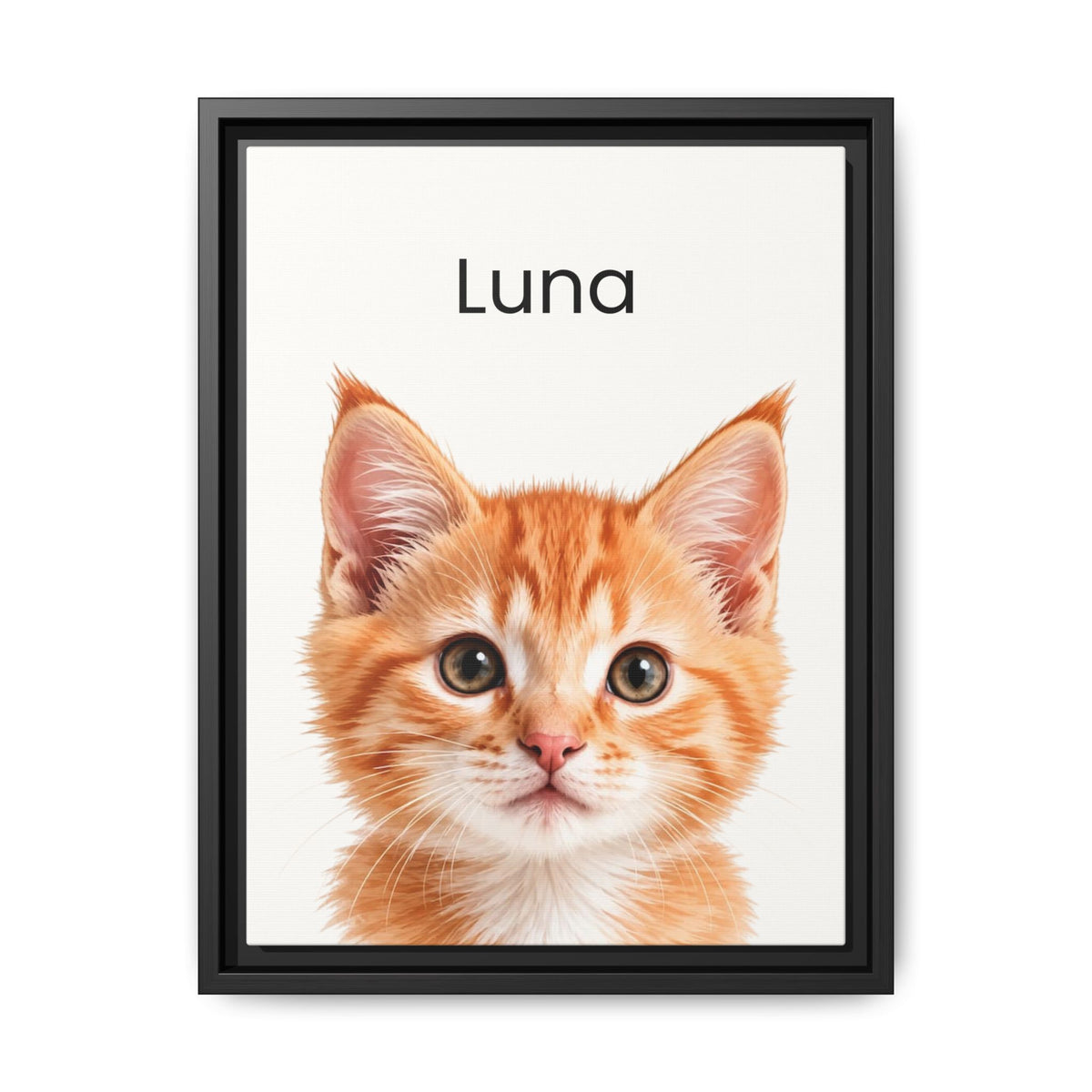 A framed custom pet portrait featuring a close-up photograph of an orange tabby kitten with the name 'Luna' printed above it, set in a black frame against a white background.