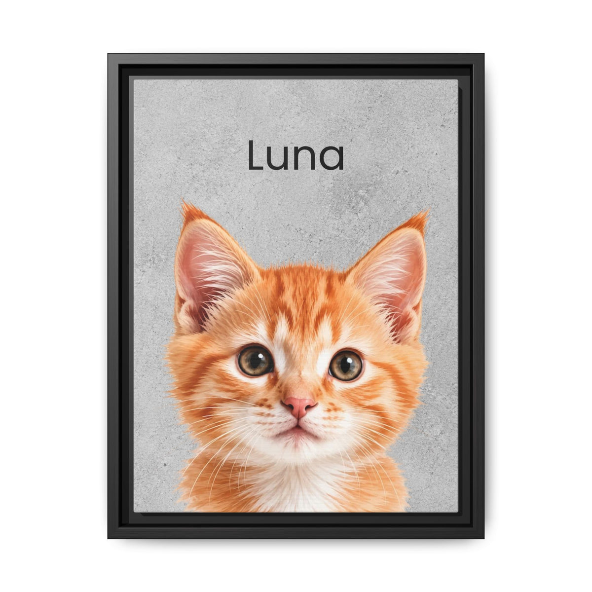 A framed custom pet portrait featuring a close-up photo of an orange tabby kitten with the name 'Luna' printed above it on a textured gray background, enclosed in a black frame.