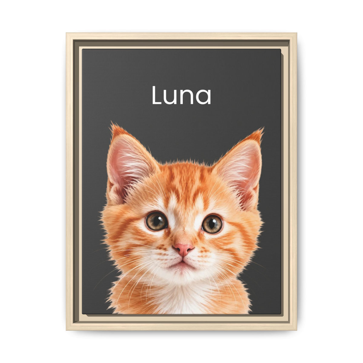 A framed custom pet portrait featuring a close-up photo of an orange tabby kitten on a dark charcoal background with the name 'Luna' printed in white at the top. The print is housed in a light beige wood frame and is displayed against a clean white background.