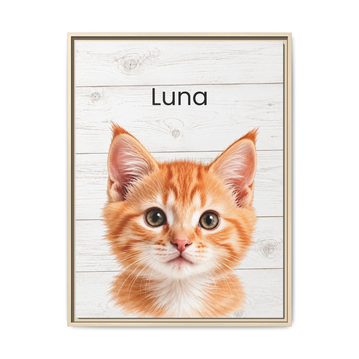 A framed personalized wall art print featuring a close-up portrait of an orange kitten on a white wood-plank background with the name 'Luna' printed above it. The print is shown in a thin light wood frame against a plain white background.
