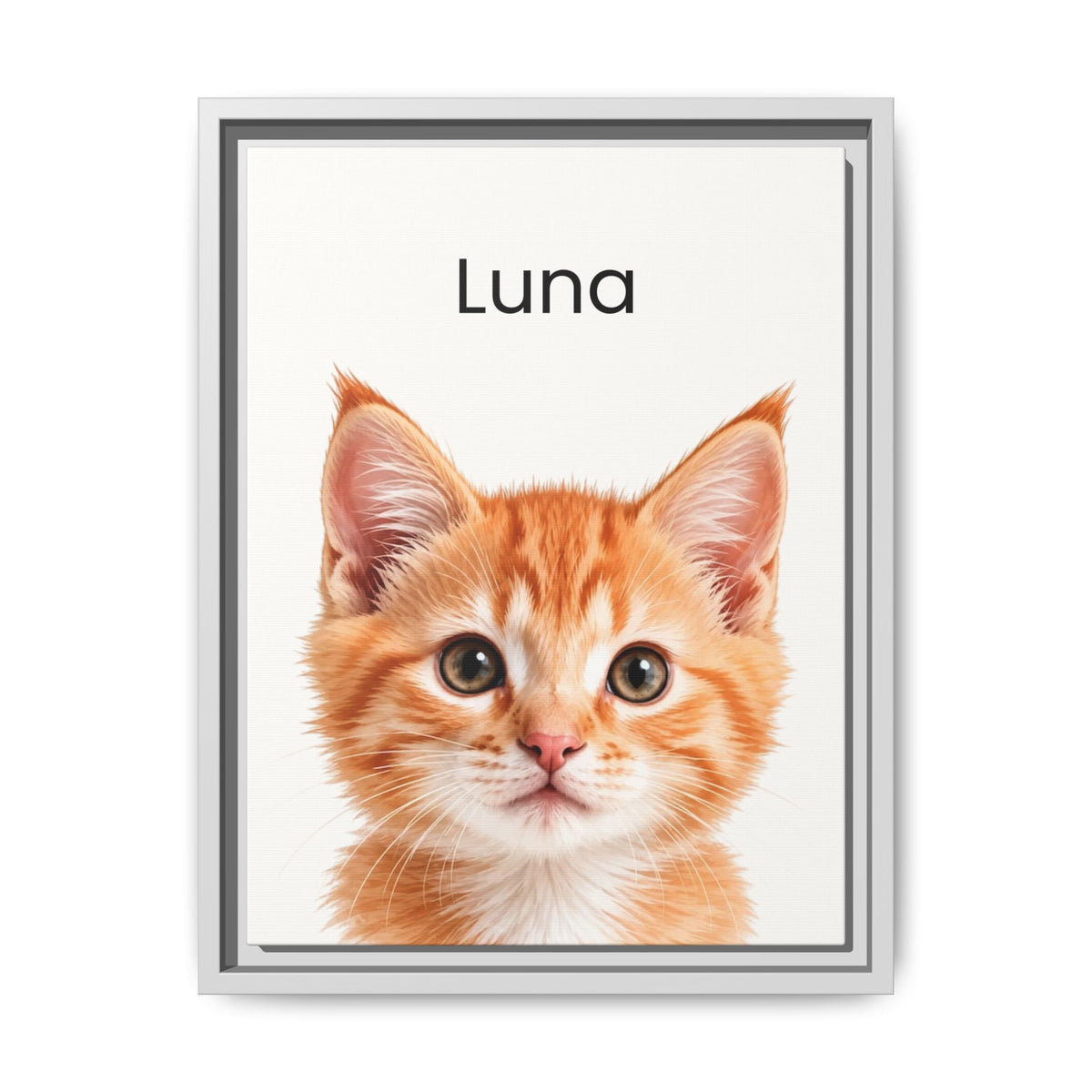 A framed custom pet portrait featuring a close-up photograph of an orange tabby kitten with the name 'Luna' printed above it, set against a clean white background.